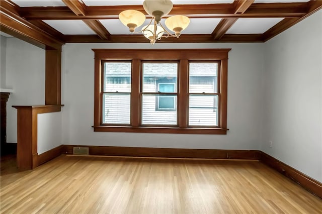 interior space featuring light wood-style floors, baseboards, an inviting chandelier, and coffered ceiling