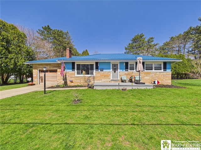 ranch-style home featuring a front lawn, stone siding, an attached garage, and a chimney