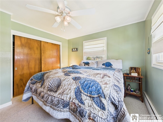 carpeted bedroom featuring a baseboard heating unit, crown molding, a ceiling fan, and baseboards