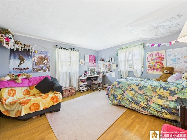bedroom with wood finished floors
