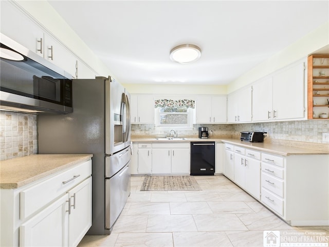 kitchen with tasteful backsplash, a sink, dishwasher, and stainless steel microwave