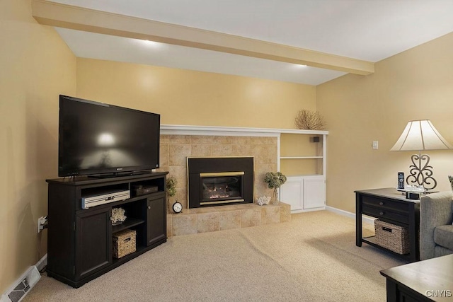 4969 Look Kinney Cir, Clay, NY 13088 - carpeted living area with a fireplace, beamed ceiling, baseboards, and visible vents
