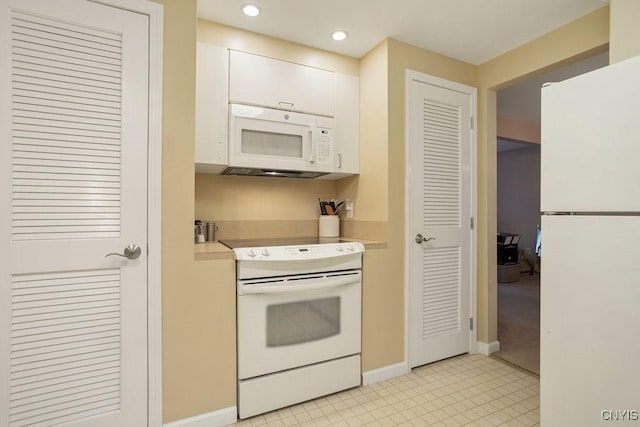 4969 Look Kinney Cir, Clay, NY 13088 - kitchen with white appliances, recessed lighting, white cabinetry, light countertops, and baseboards