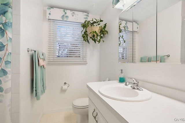 4969 Look Kinney Cir, Clay, NY 13088 - full bath featuring a wealth of natural light, baseboards, vanity, and toilet