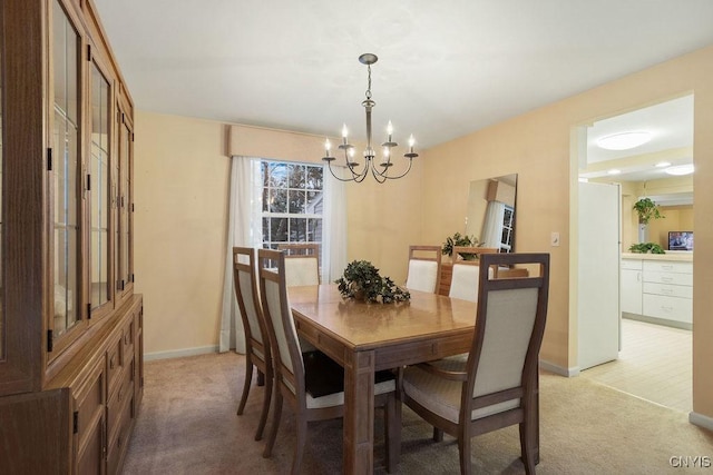 4969 Look Kinney Cir, Clay, NY 13088 - dining area with an inviting chandelier, light carpet, and baseboards