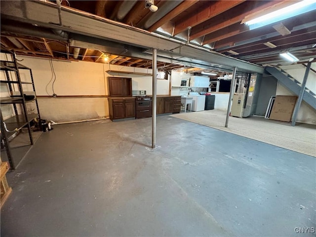 4969 Look Kinney Cir, Clay, NY 13088 - unfinished basement featuring heating unit, washing machine and clothes dryer, and stairway