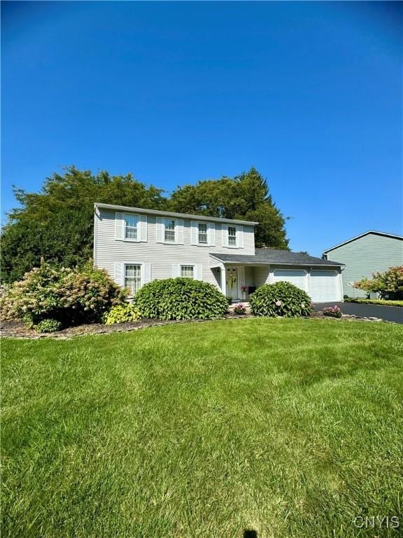 4969 Look Kinney Cir, Clay, NY 13088 - view of front facade with an attached garage, driveway, and a front yard