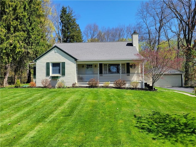 single story home with a porch, a chimney, a front yard, an outbuilding, and a detached garage