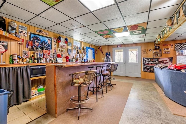 394 Nersesian Rd, Otsego, NY 13348 - bar with a dry bar, a paneled ceiling, built in microwave, and wood walls