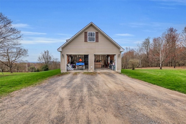 394 Nersesian Rd, Otsego, NY 13348 - view of front of home with a detached garage, an outdoor structure, and a front lawn
