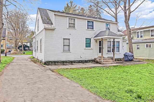 exterior space featuring a front lawn
