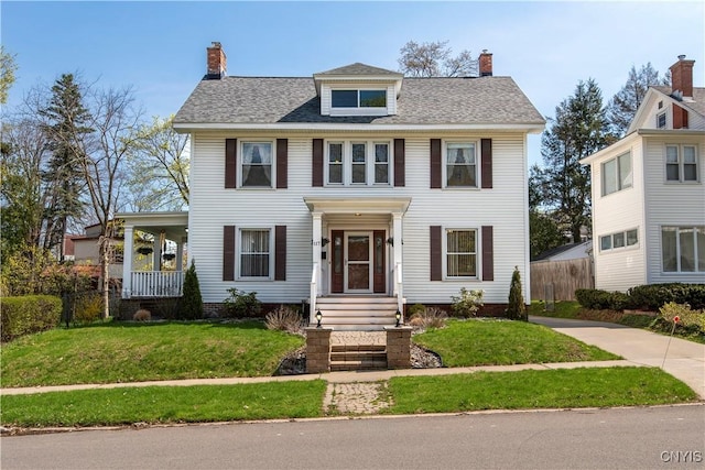 117 Proctor Blvd, Utica, NY 13501 - view of front facade featuring a front yard, a chimney, and fence