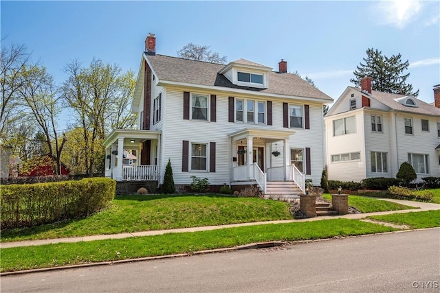 117 Proctor Blvd, Utica, NY 13501 - view of front of property featuring a chimney, a porch, and a front yard