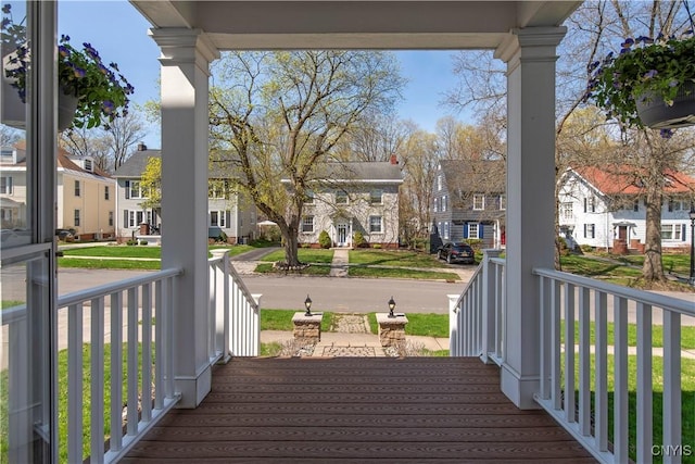 117 Proctor Blvd, Utica, NY 13501 - wooden deck featuring a porch and a residential view