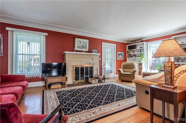 117 Proctor Blvd, Utica, NY 13501 - living area with hardwood / wood-style flooring, a healthy amount of sunlight, crown molding, and a brick fireplace