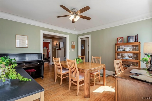 117 Proctor Blvd, Utica, NY 13501 - dining area featuring ceiling fan, crown molding, light wood finished floors, and baseboards