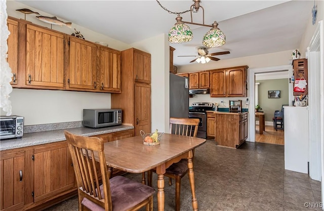 117 Proctor Blvd, Utica, NY 13501 - kitchen featuring a toaster, stainless steel appliances, under cabinet range hood, brown cabinets, and ceiling fan