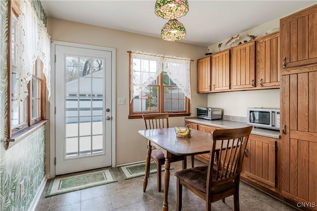 117 Proctor Blvd, Utica, NY 13501 - dining area with a toaster and baseboards