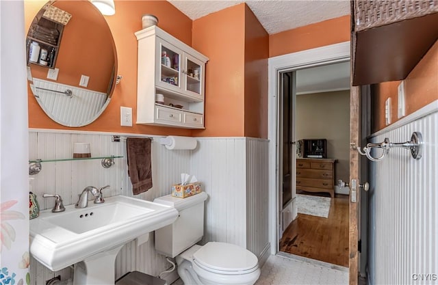 117 Proctor Blvd, Utica, NY 13501 - bathroom with a sink, toilet, and wainscoting