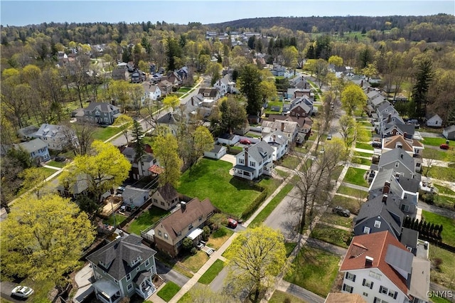 117 Proctor Blvd, Utica, NY 13501 - drone / aerial view with a residential view and a wooded view