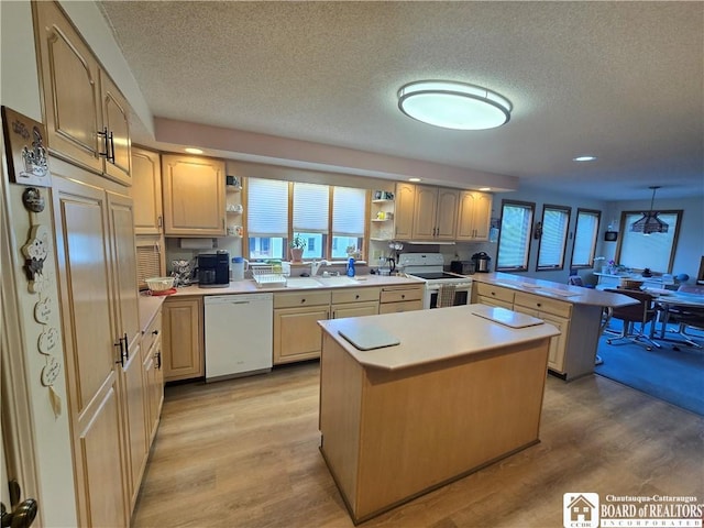 kitchen featuring a textured ceiling, white appliances, open shelves, and a peninsula