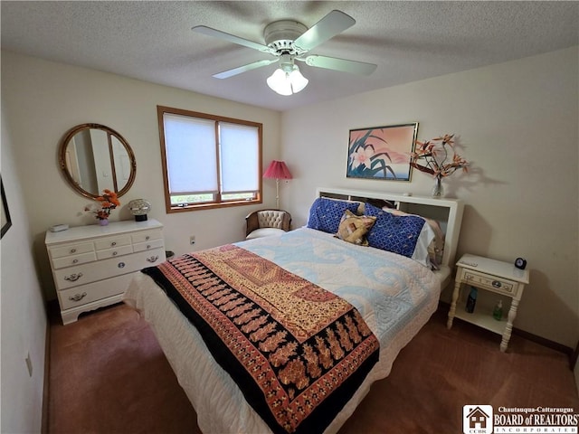 carpeted bedroom featuring a textured ceiling and ceiling fan
