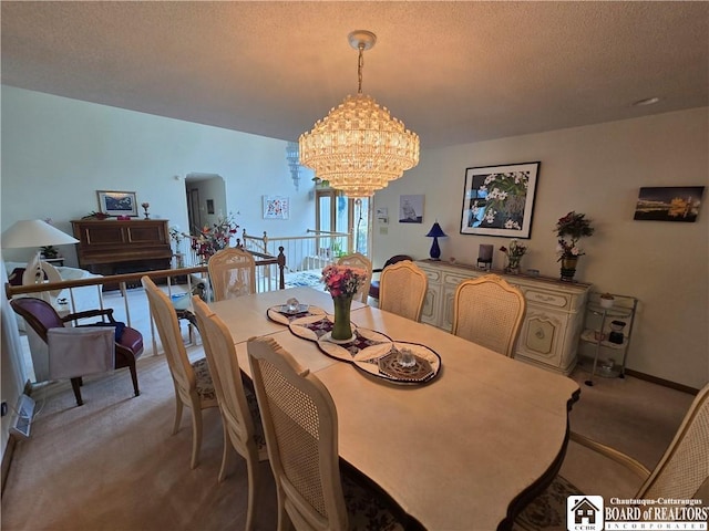 dining area featuring arched walkways, an inviting chandelier, light carpet, and a textured ceiling