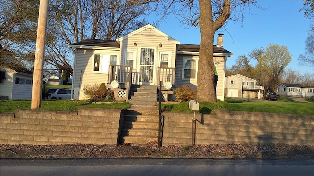 48 King St, Mentz, NY 13140 - view of front of home featuring a chimney and a front yard