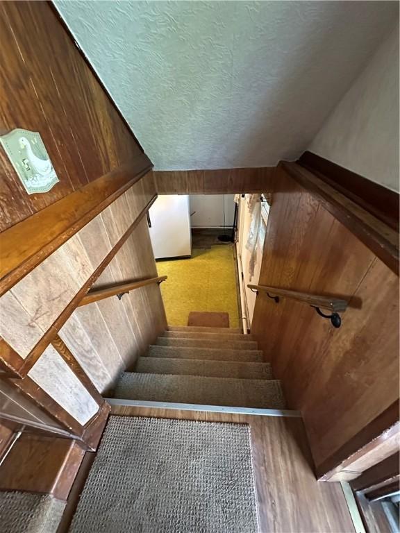 48 King St, Mentz, NY 13140 - stairway with a textured ceiling