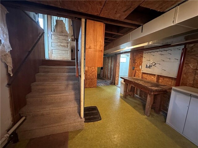 48 King St, Mentz, NY 13140 - unfinished below grade area featuring tile patterned floors and stairway