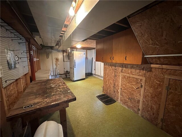 48 King St, Mentz, NY 13140 - unfinished below grade area with freestanding refrigerator and light floors