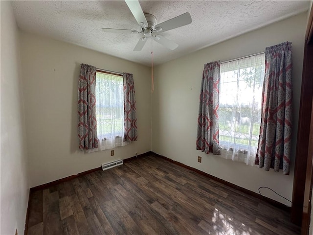 48 King St, Mentz, NY 13140 - unfurnished room with healthy amount of natural light, a textured ceiling, dark wood-style floors, ceiling fan, and baseboards