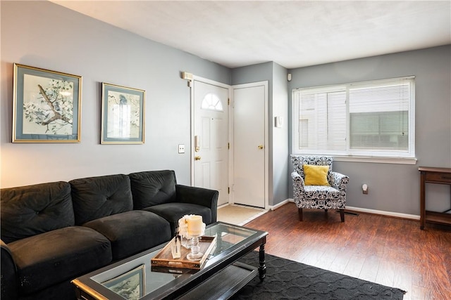 living room with wood finished floors and baseboards