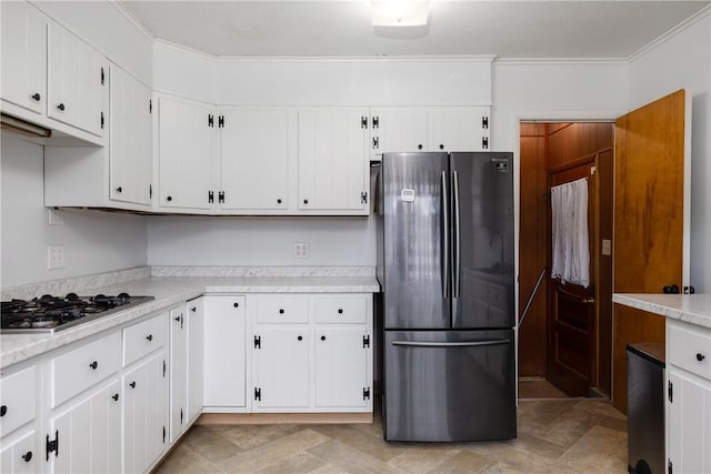 kitchen featuring white cabinetry, appliances with stainless steel finishes, and light countertops