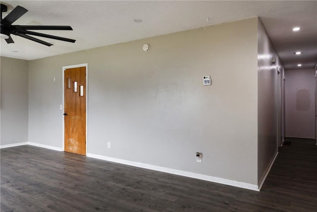 spare room with a textured ceiling, baseboards, recessed lighting, dark wood-type flooring, and a ceiling fan