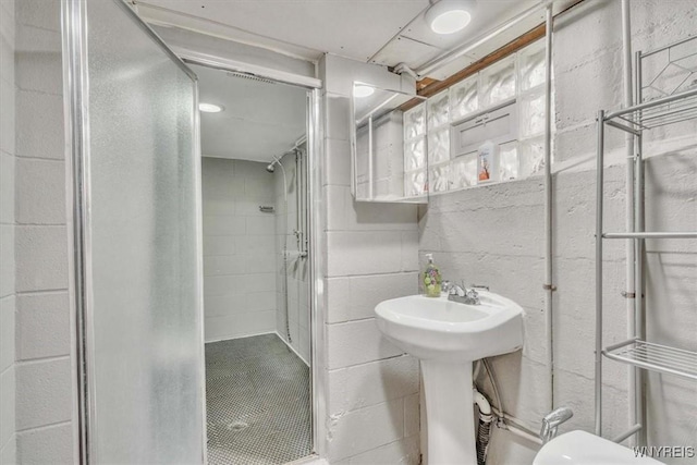bathroom with a stall shower and toilet