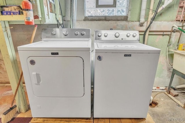 laundry room with separate washer and dryer