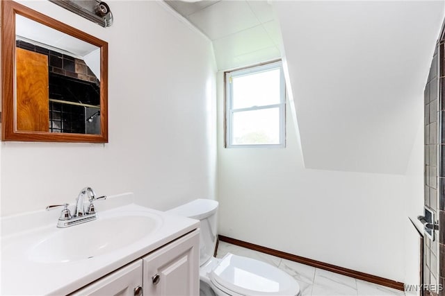 bathroom with toilet, baseboards, marble finish floor, and vanity