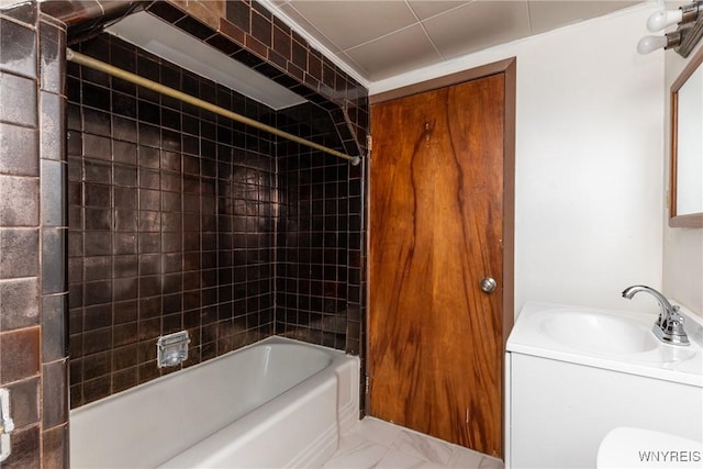full bathroom with washtub / shower combination, marble finish floor, and vanity