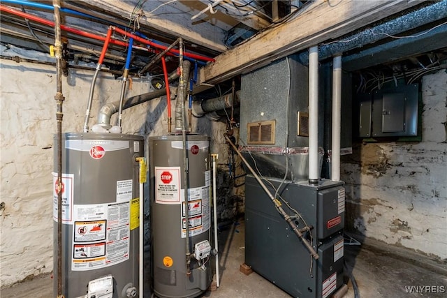 utility room featuring visible vents, water heater, and electric panel