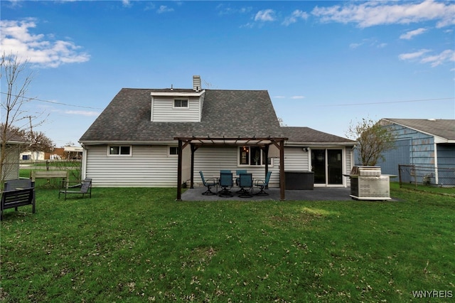 back of house with a patio area, a chimney, a pergola, and a yard