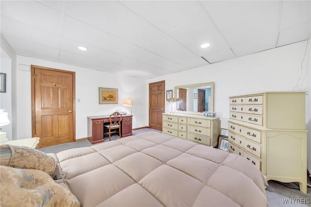 bedroom with light colored carpet, recessed lighting, and baseboards