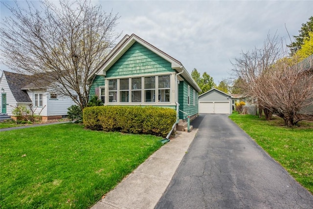 72 Whiteford Rd, Rochester, NY 14620 - view of front facade featuring an outdoor structure, a front yard, and a garage