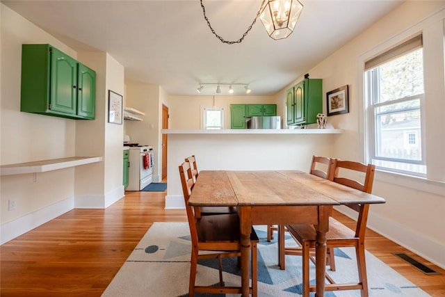 72 Whiteford Rd, Rochester, NY 14620 - dining area featuring visible vents, light wood-type flooring, and baseboards