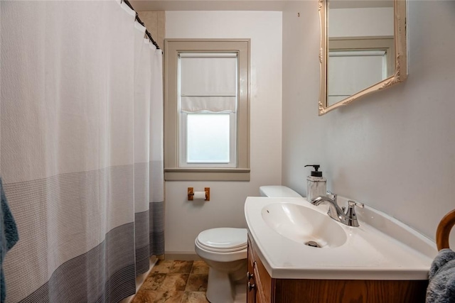 72 Whiteford Rd, Rochester, NY 14620 - bathroom featuring baseboards, curtained shower, toilet, and vanity