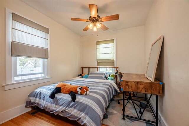 72 Whiteford Rd, Rochester, NY 14620 - bedroom featuring wood finished floors, ceiling fan, and baseboards