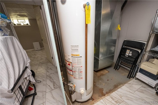 utility room with gas water heater