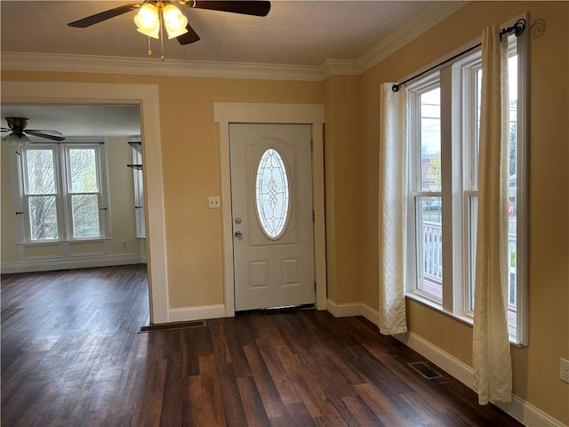foyer with dark wood finished floors, baseboards, and ceiling fan