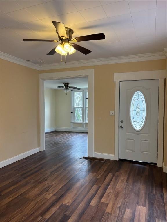foyer with ornamental molding, ceiling fan, baseboards, and dark wood finished floors