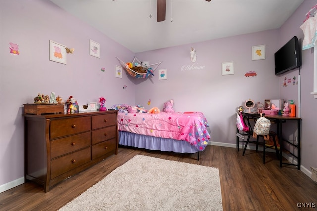 bedroom with wood finished floors, ceiling fan, and baseboards